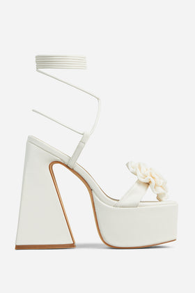 Lippy Lace Up Rose Detail Platform Block Heel In Cream Faux Leather Lippy Lace Up Rose Detail Platform Block Heel In Cream Faux Leather