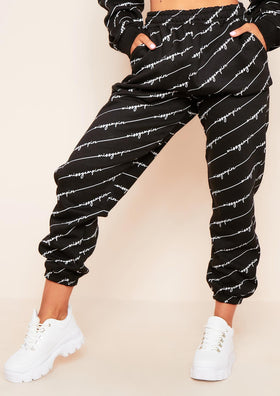 Eliora Black Missy Empire Repetitive Slogan Joggers Eliora Black Missy Empire Repetitive Slogan Joggers
